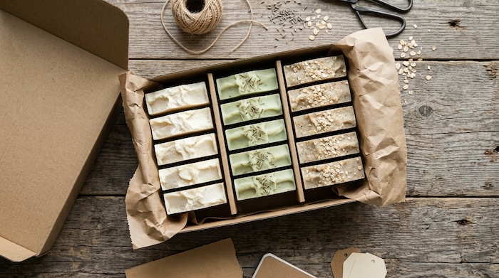 Handmade soap bars stored in a ventilated cardboard box to keep them dry.